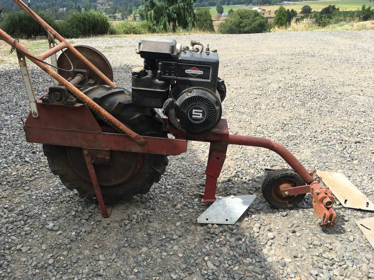 Farm And Garden Cultivator like the Row Buster, Plow Hoss, Power Wheel, And A Mule